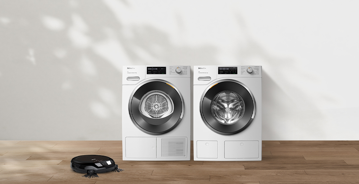Experience the Perfect Laundry Pair and get a Free Robot Vacuum Cleaner. Image